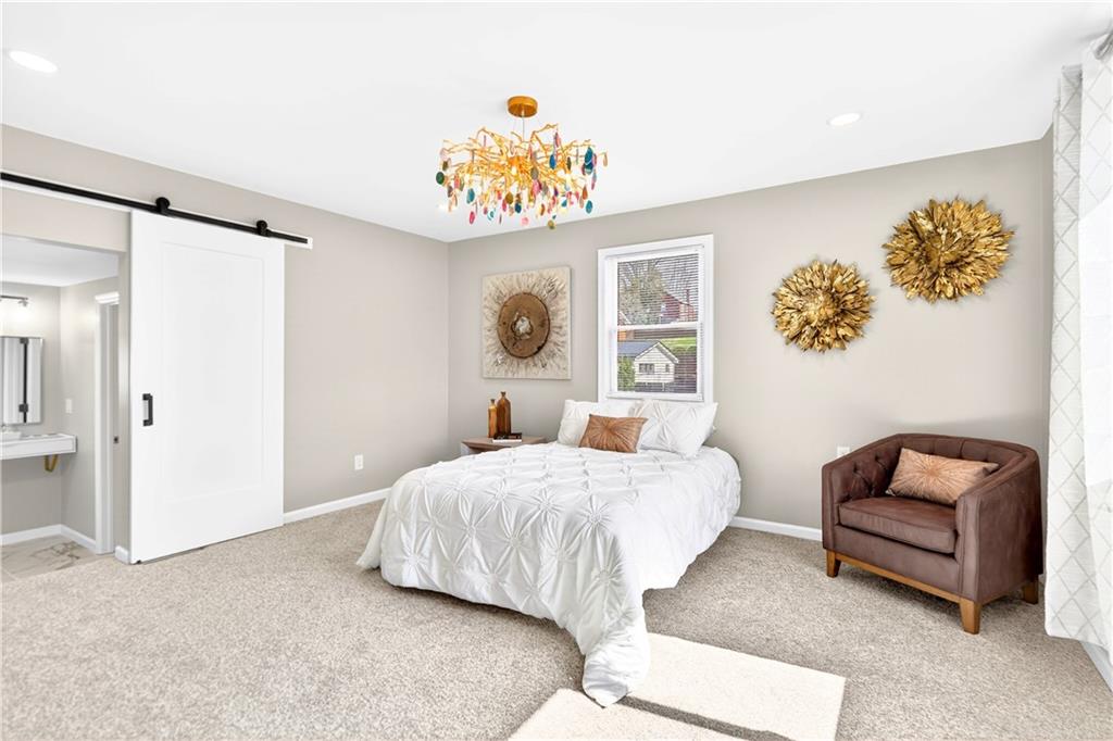 731 Chartiers Street Bridgeville, PA 15017 - Photo 26 of 48 a bedroom with a bed and a couch