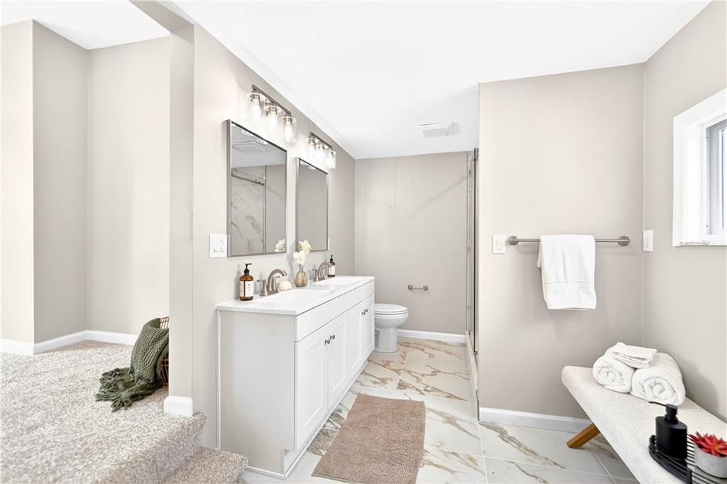 731 Chartiers Street Bridgeville, PA 15017 - Photo 30 of 48 a bathroom with a sink and a mirror