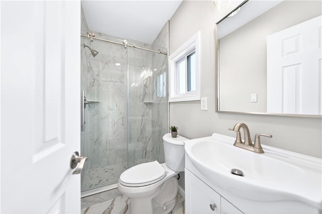 731 Chartiers Street Bridgeville, PA 15017 - Photo 37 of 48 a bathroom with a sink toilet and shower