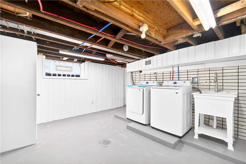731 Chartiers Street Bridgeville, PA 15017 - Photo 38 of 48 a utility room with dryer and washer
