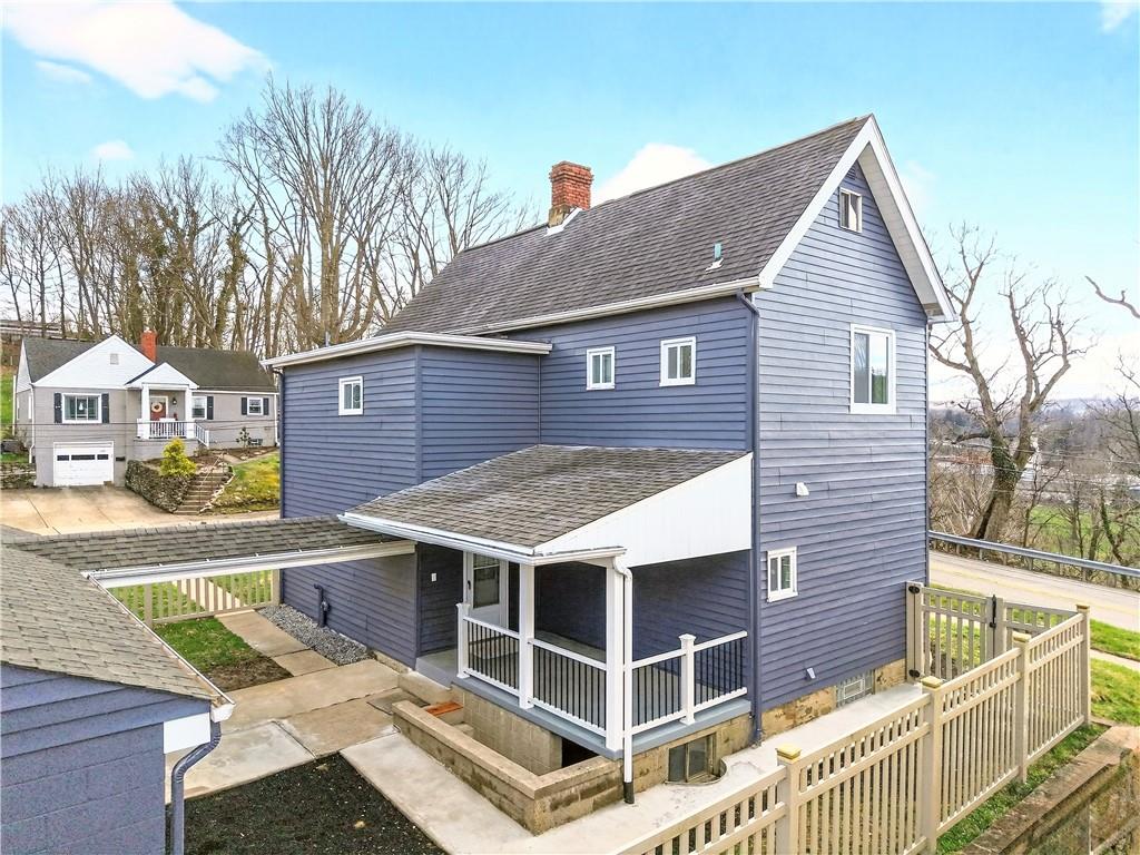 731 Chartiers Street Bridgeville, PA 15017 - Photo 5 of 48 a view of a house with wooden deck and furniture