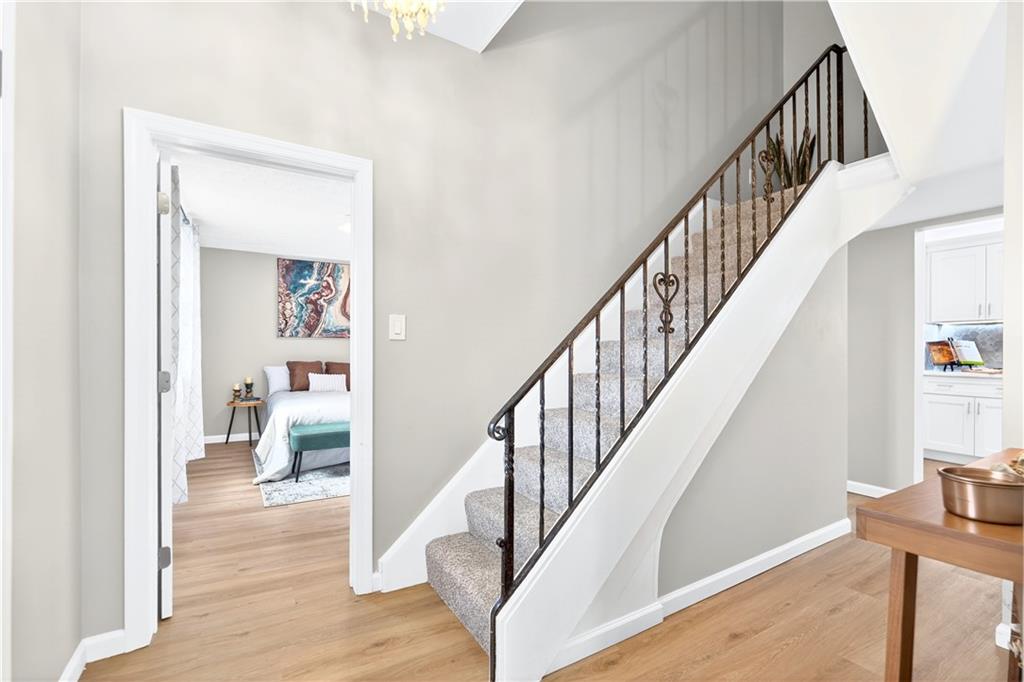 731 Chartiers Street Bridgeville, PA 15017 - Photo 7 of 48 a view of entryway and hall with wooden floor