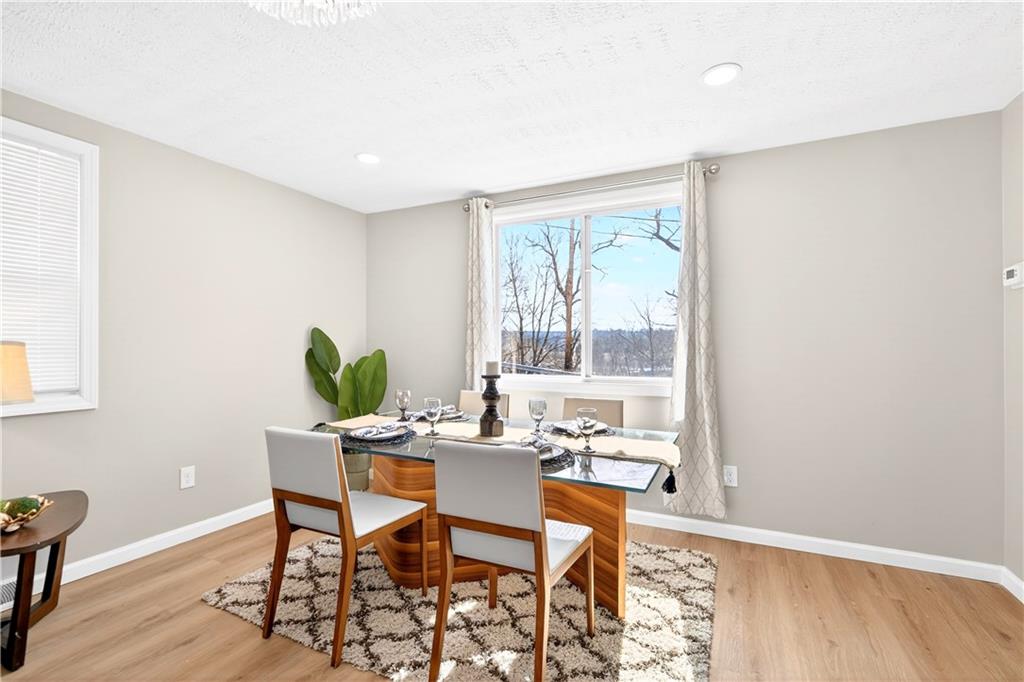 731 Chartiers Street Bridgeville, PA 15017 - Photo 10 of 48 a dining room with furniture and wooden floor