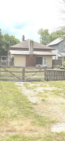 a view of a swimming pool with a lawn chairs