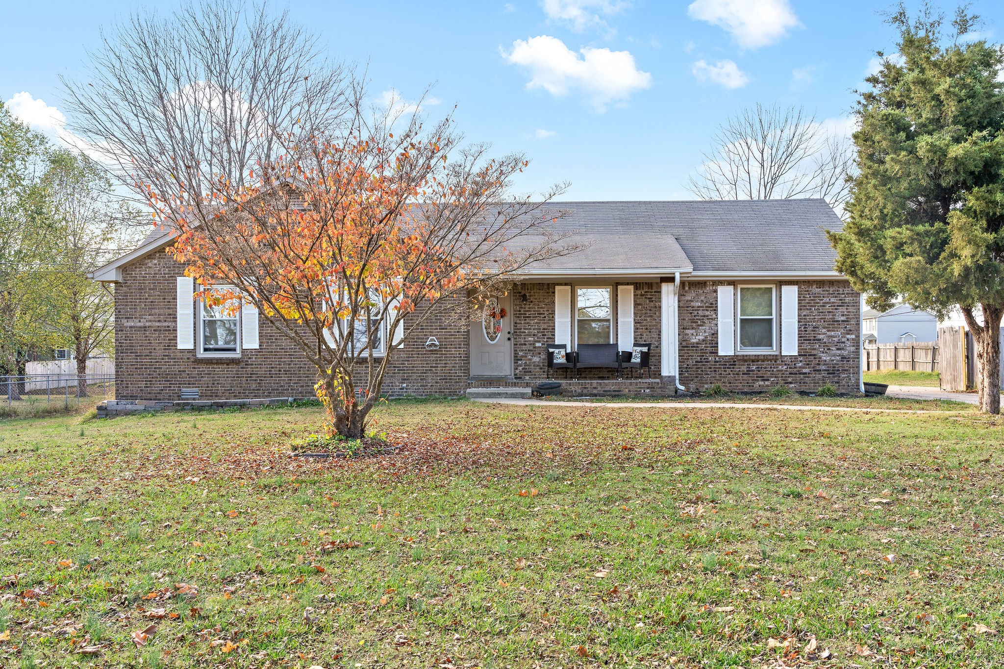 a house view with swimming pool in front of it