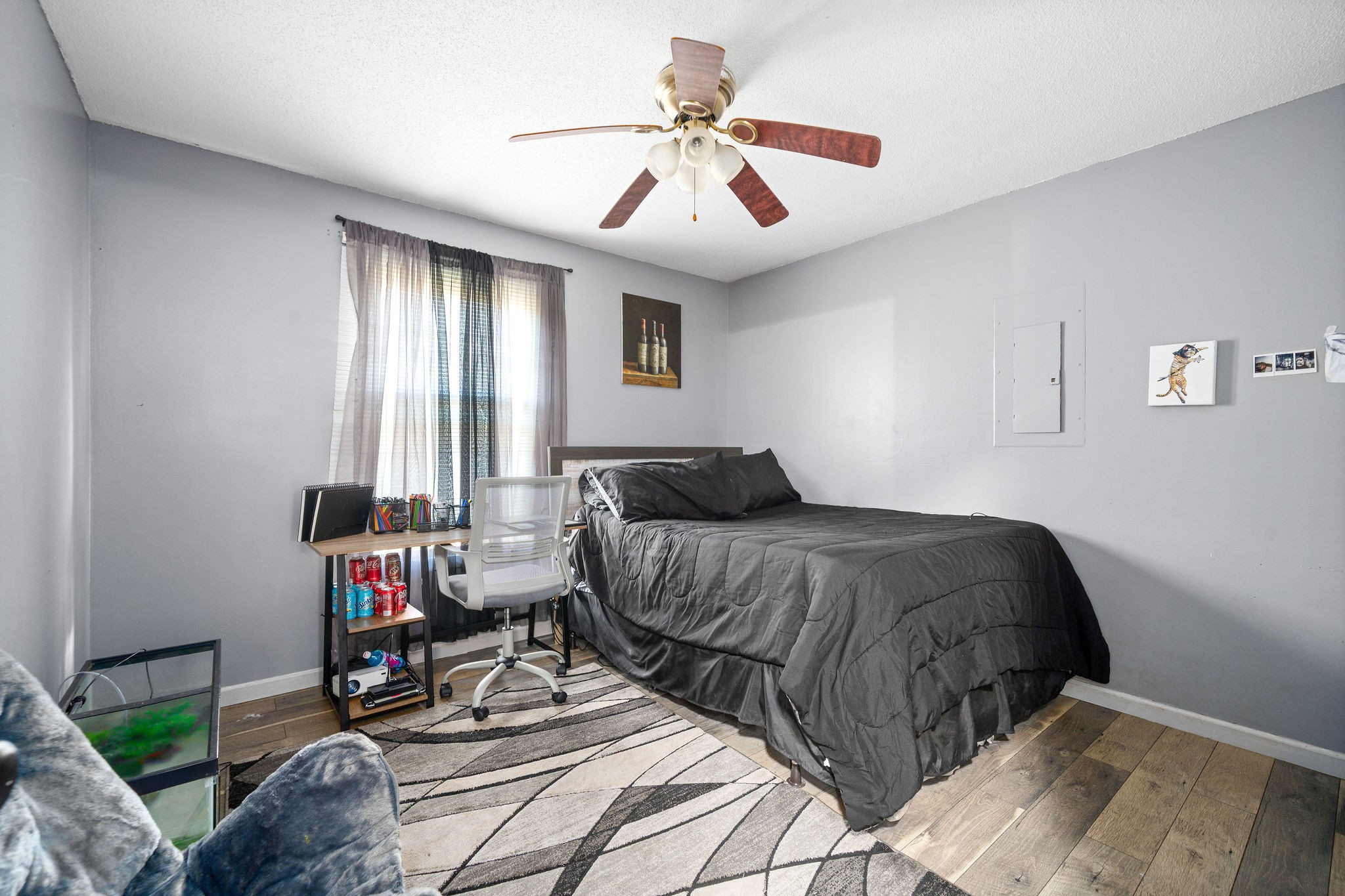 3410 Allen Road Clarksville, TN 37042 - Photo 11 of 12 a bedroom with a bed and a chandelier