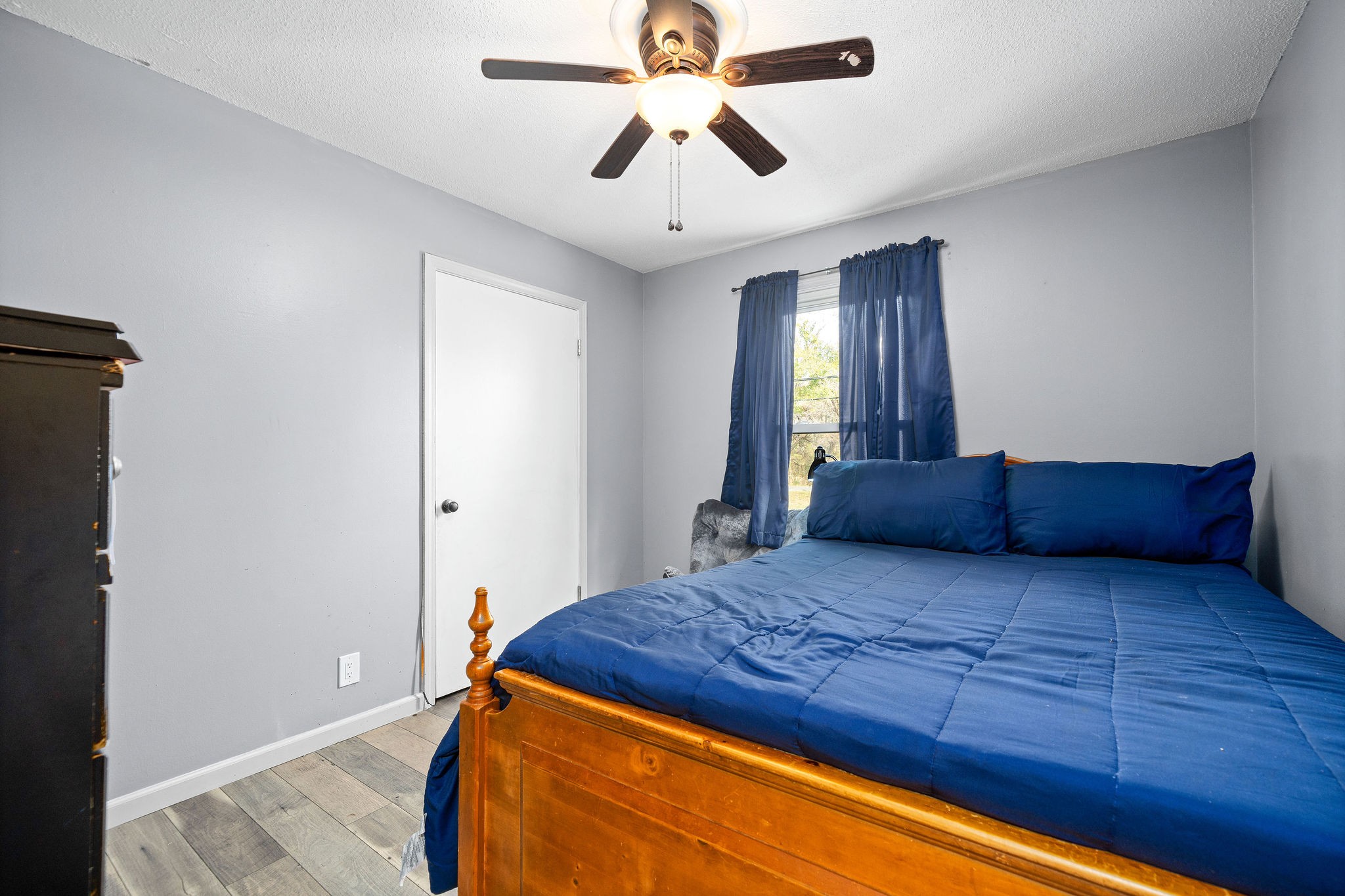 3410 Allen Road Clarksville, TN 37042 - Photo 9 of 12 a bedroom with a large bed and a chandelier