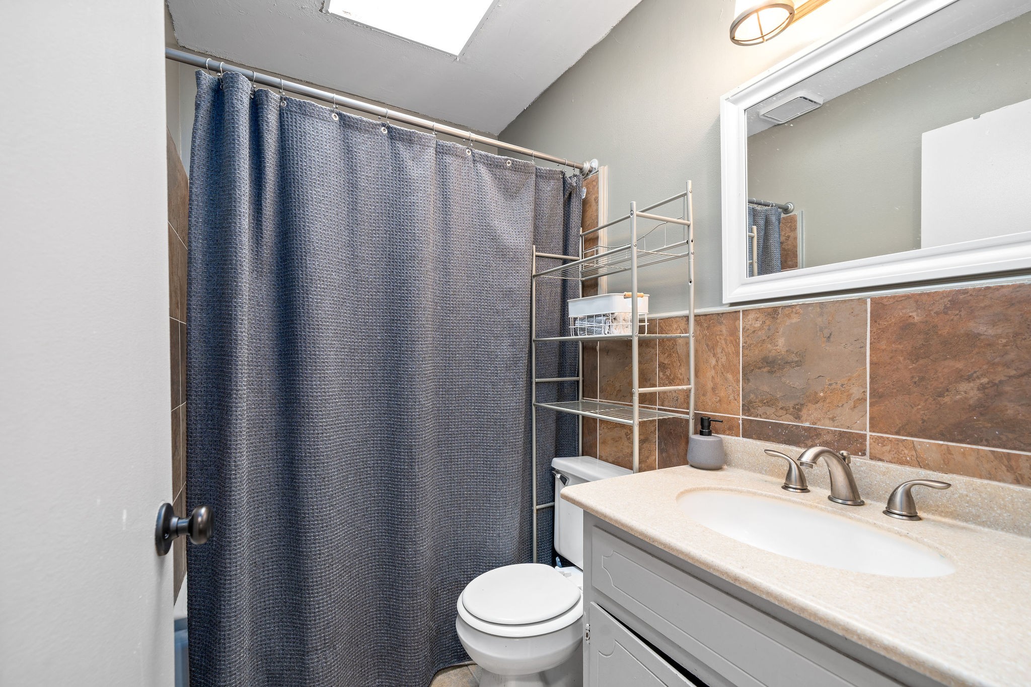 3410 Allen Road Clarksville, TN 37042 - Photo 10 of 12 a bathroom with a sink toilet and shower