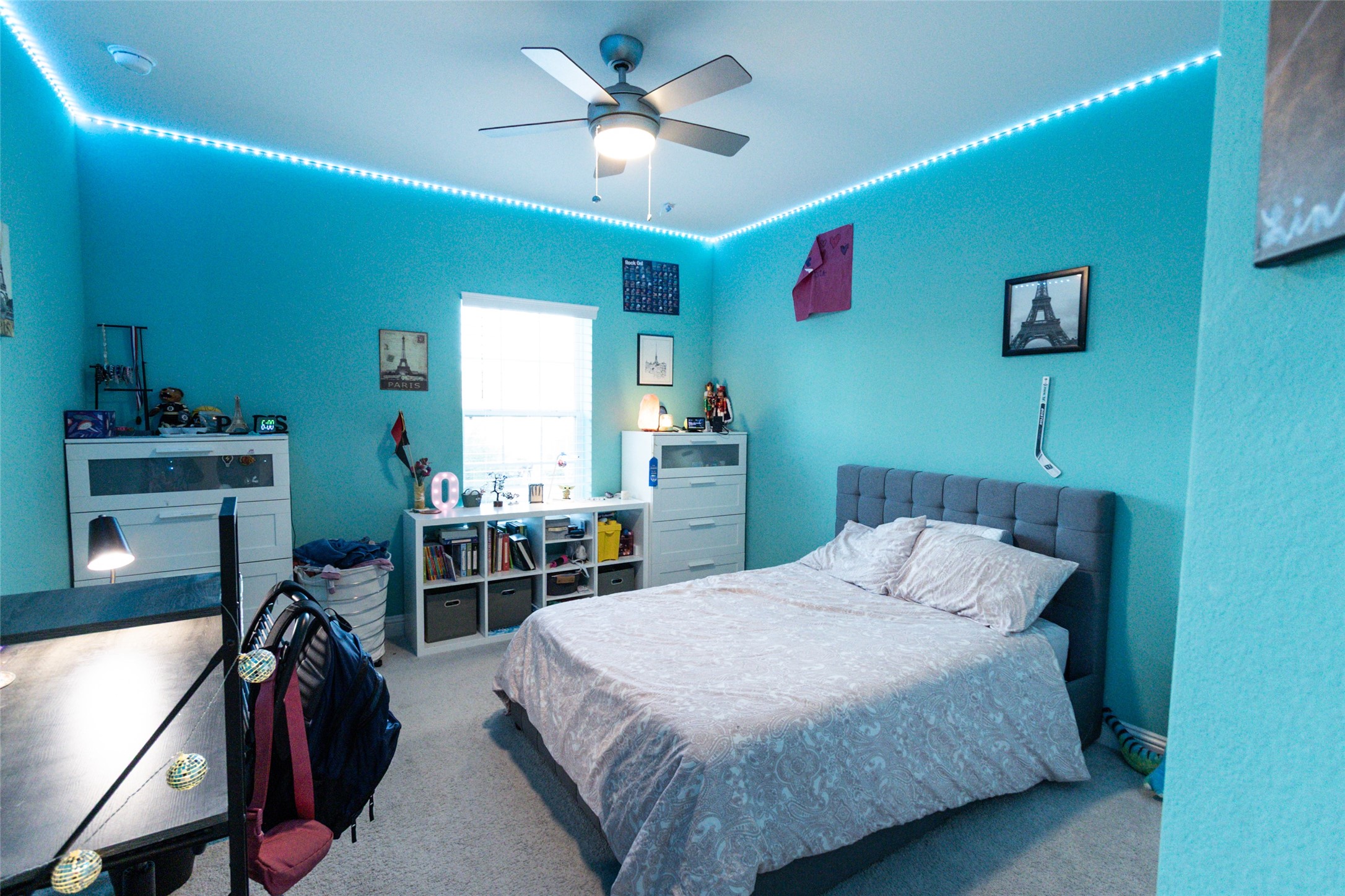 32106 Aspen Grove Court Spring, TX 77386 - Photo 15 of 28 a bedroom with a bed and a chandelier