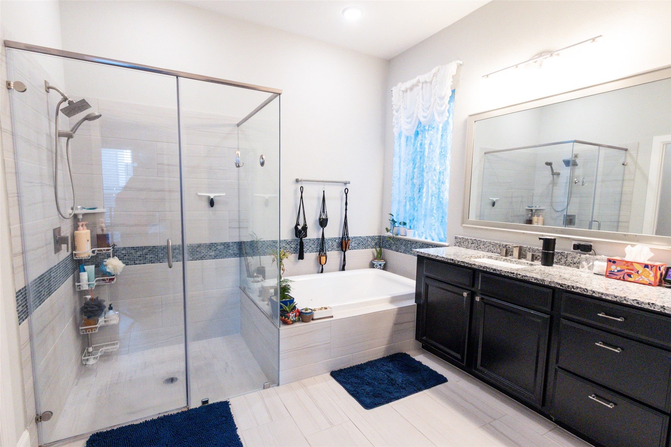 32106 Aspen Grove Court Spring, TX 77386 - Photo 8 of 28 a bathroom with a tub sink and mirror