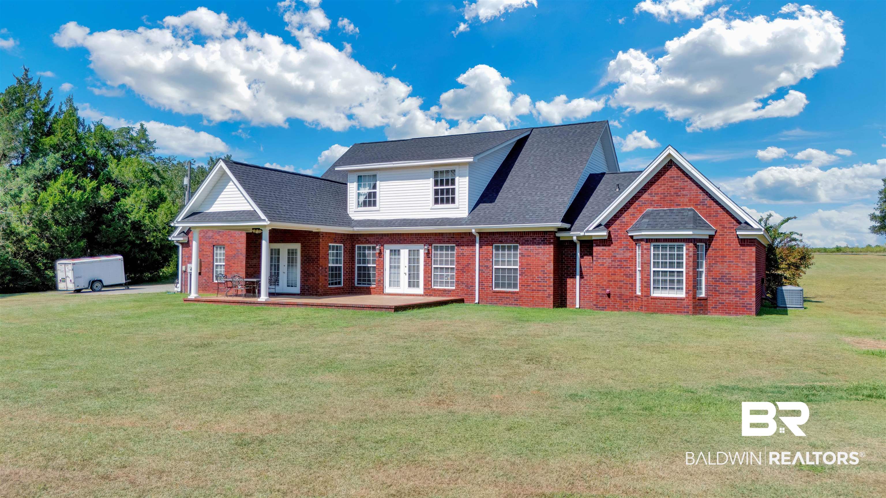 27688 Rigsby Road Daphne, AL 36526 - Photo 49 of 56 View of front facade with a front lawn