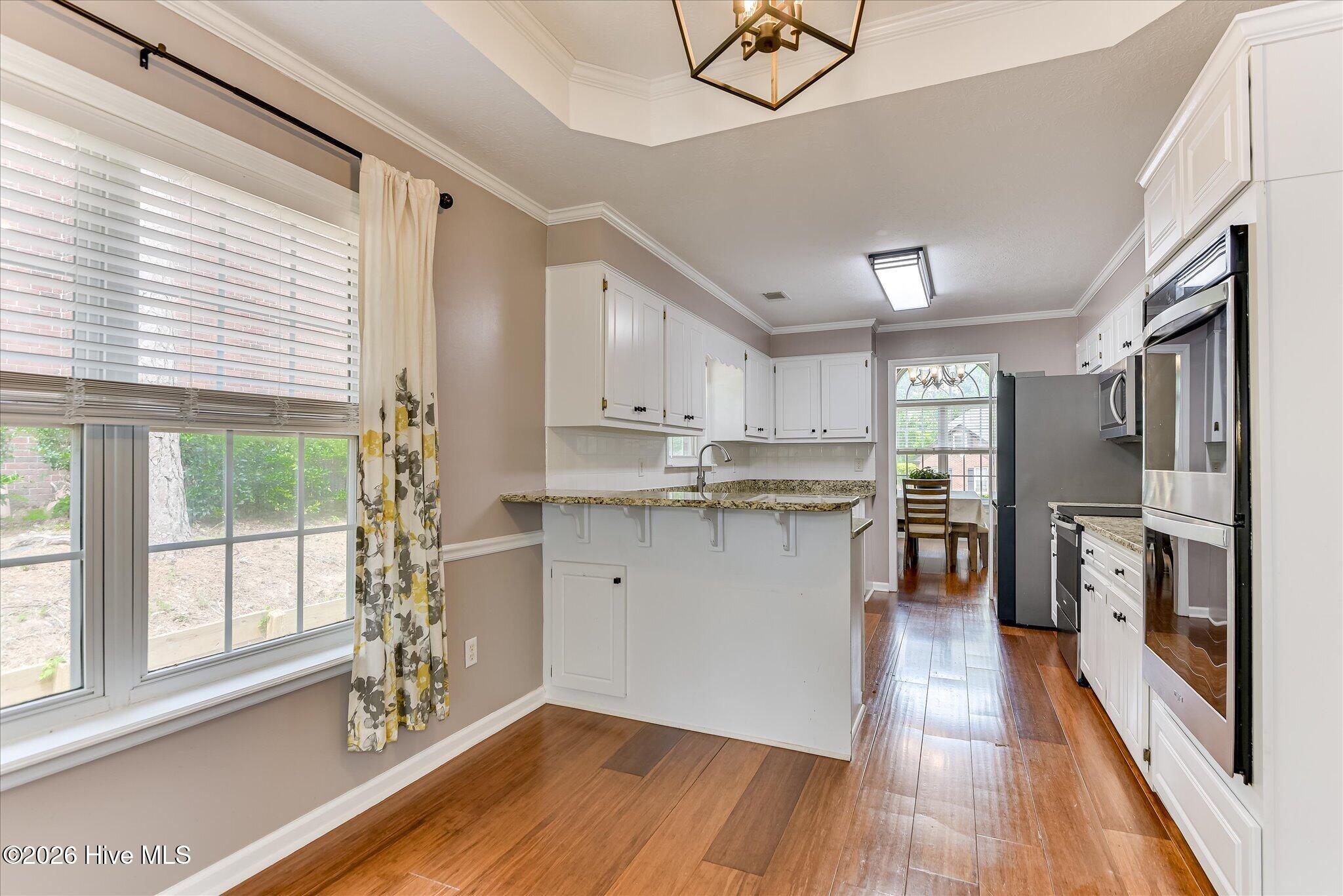 4480 Cape Cod Drive Evans, GA 30809 - Photo 8 of 55 Kitchen also has the same Beautiful wood floors!