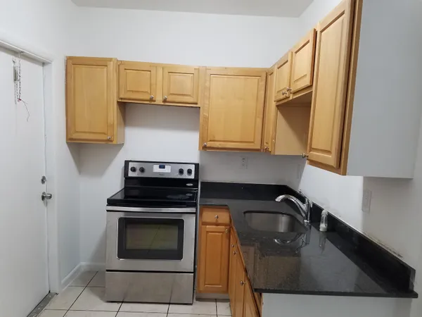 a kitchen with a stove and a sink