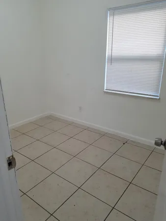 a kitchen with a stove and a cabinet