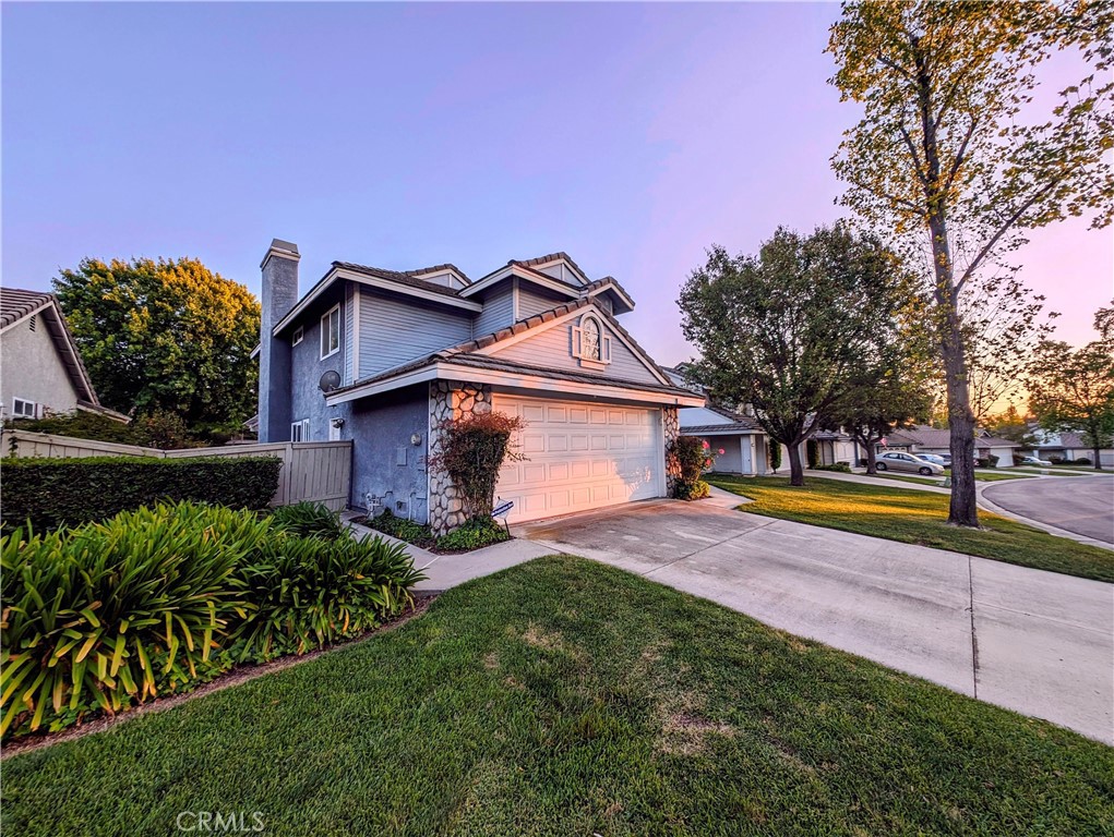 1738 Cambridge Circle Redlands, CA 92374 - Photo 1 of 59 a view of a house with a swimming pool and a yard