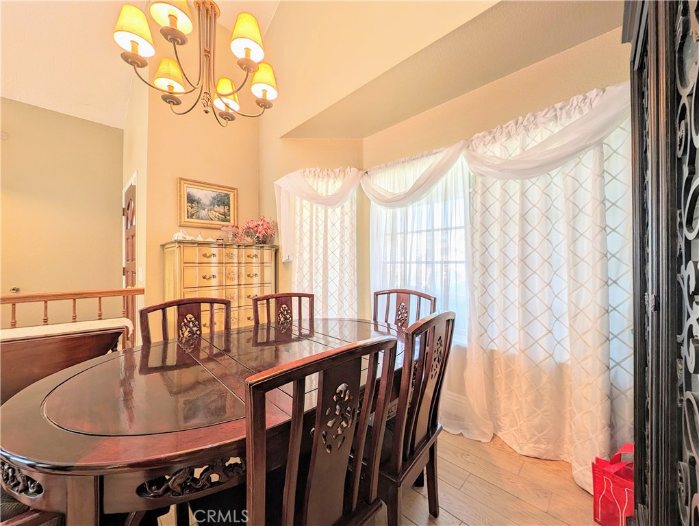 1738 Cambridge Circle Redlands, CA 92374 - Photo 13 of 59 a dining room with furniture and window