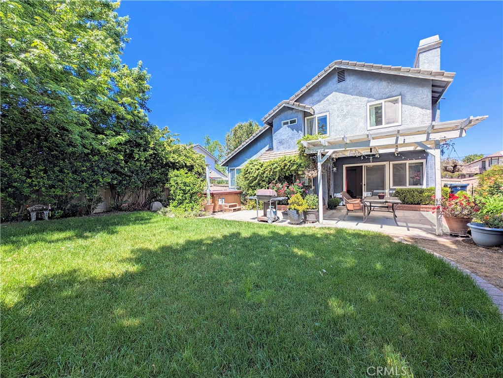 1738 Cambridge Circle Redlands, CA 92374 - Photo 27 of 59 a front view of a house with garden