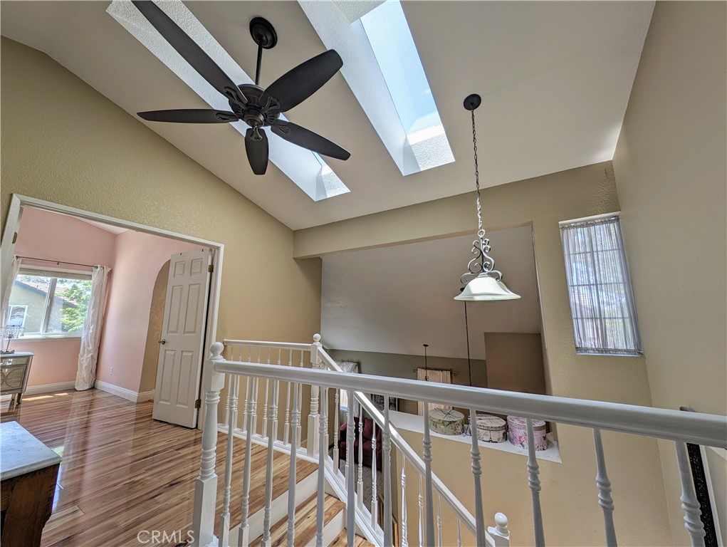 1738 Cambridge Circle Redlands, CA 92374 - Photo 30 of 59 a view of a hallway with wooden floor and staircase
