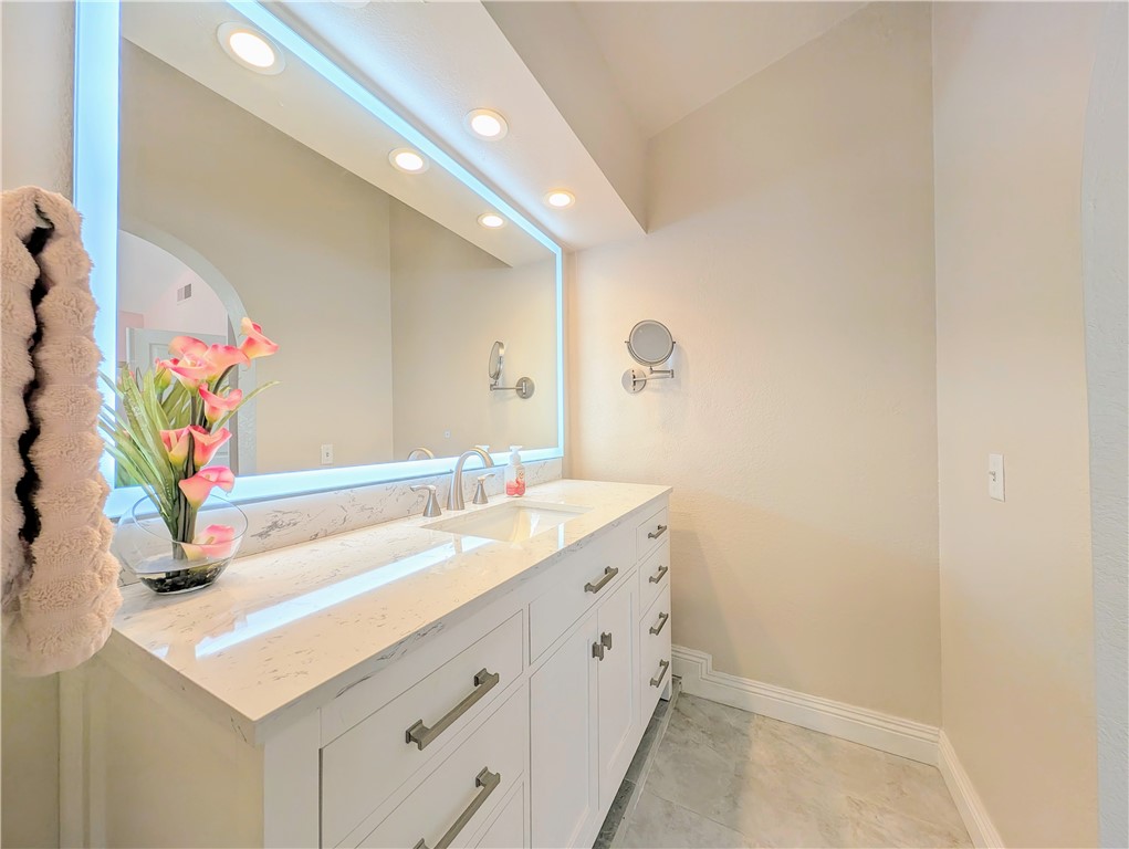1738 Cambridge Circle Redlands, CA 92374 - Photo 34 of 59 a bathroom with a sink and a mirror