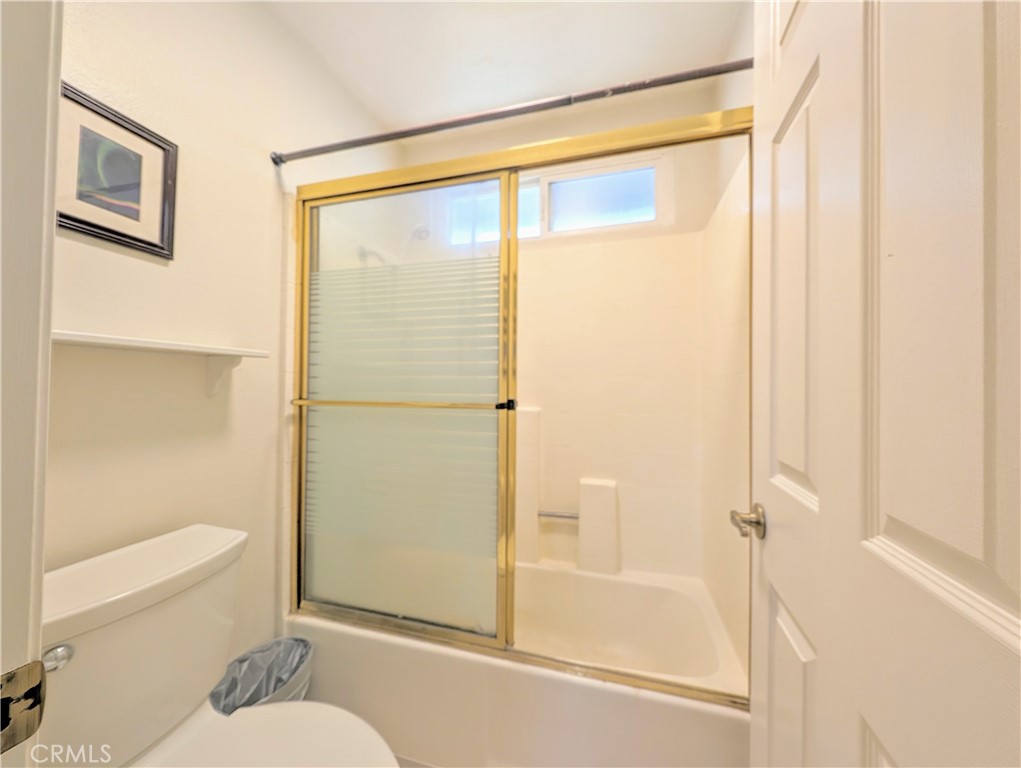 1738 Cambridge Circle Redlands, CA 92374 - Photo 42 of 59 a bathroom with a glass shower door