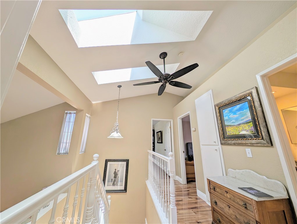 1738 Cambridge Circle Redlands, CA 92374 - Photo 43 of 59 a view of a livingroom with wooden floor and a ceiling fan
