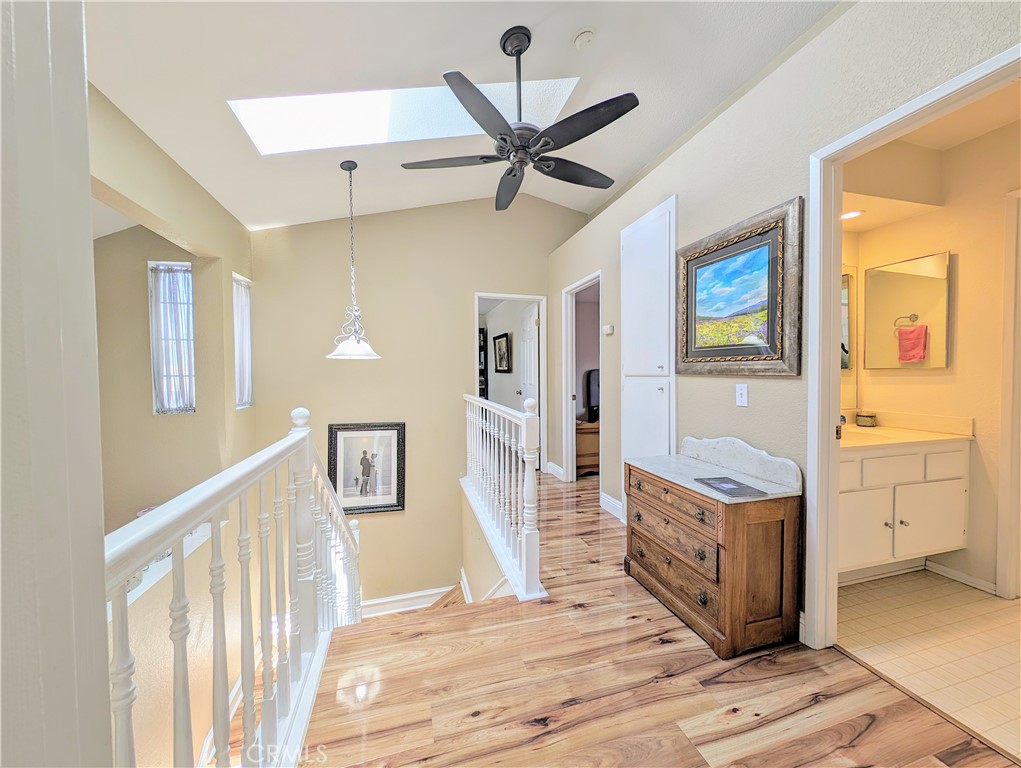 1738 Cambridge Circle Redlands, CA 92374 - Photo 44 of 59 a view of a hallway with closet and wooden floor