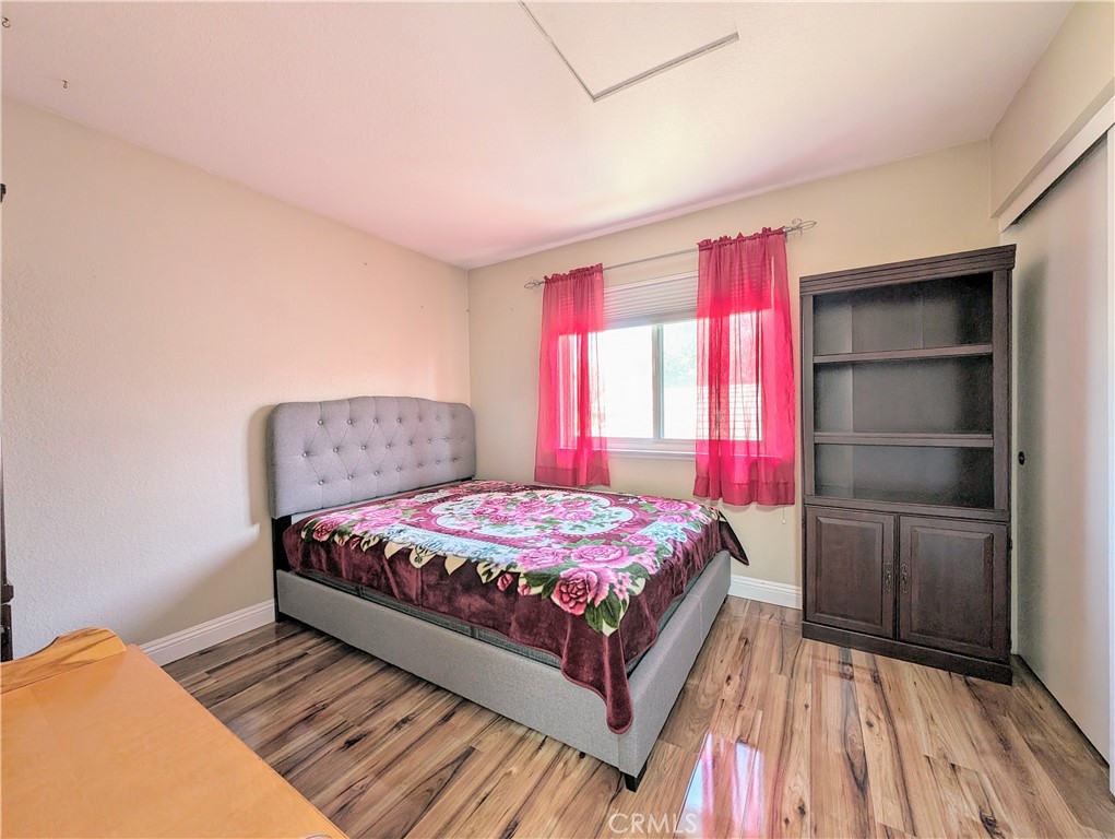 1738 Cambridge Circle Redlands, CA 92374 - Photo 45 of 59 a bedroom with a bed and a window