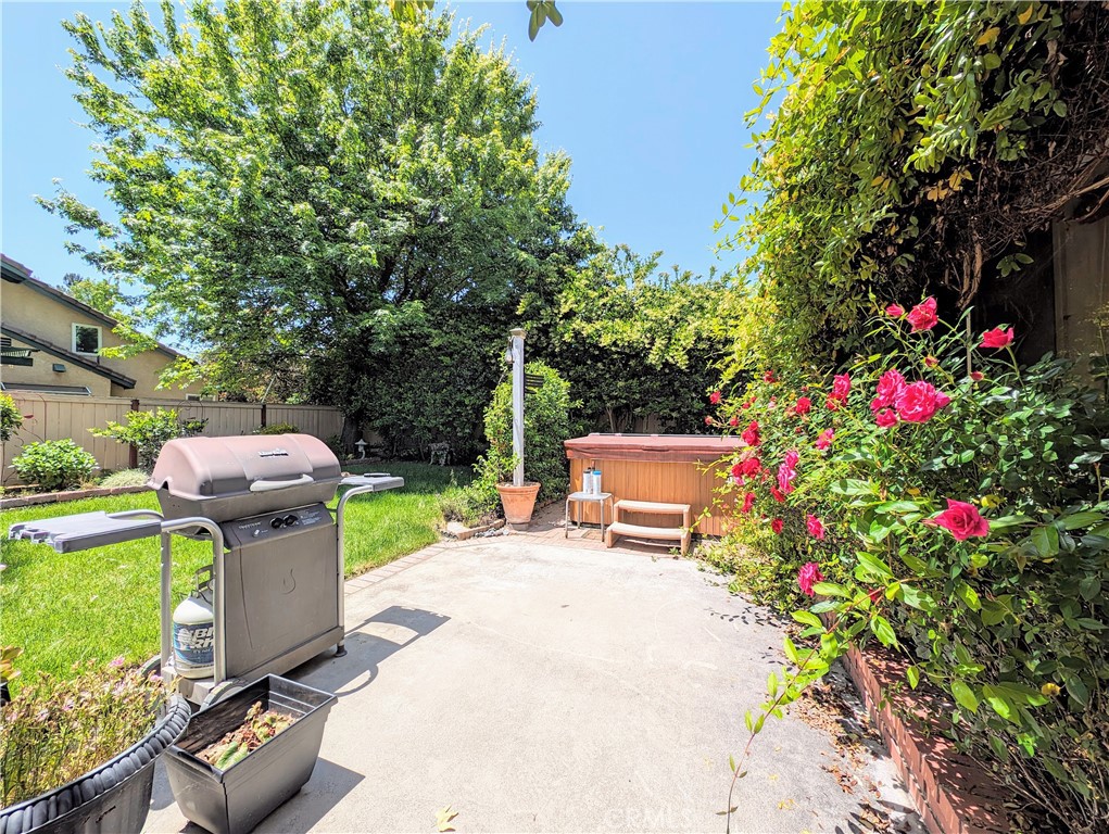 1738 Cambridge Circle Redlands, CA 92374 - Photo 51 of 59 Hot tub, with Jasmine Living privacy wall, and honeysuckle already matured and ready for enjoying the scent and flowers while you relax
