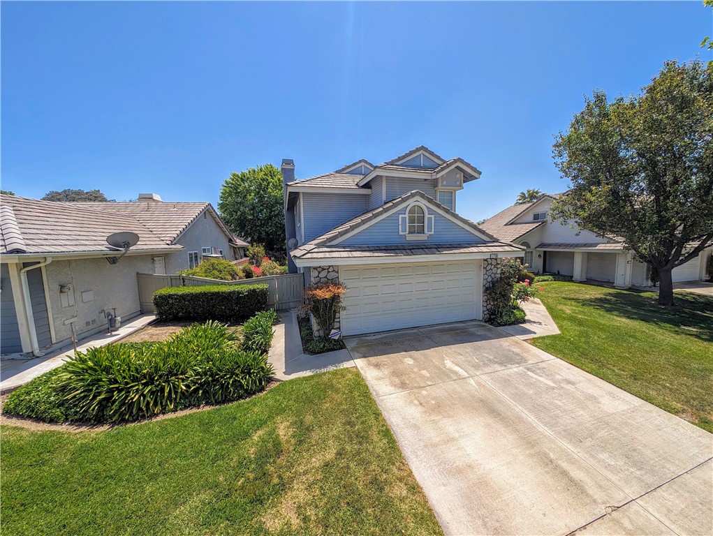 1738 Cambridge Circle Redlands, CA 92374 - Photo 58 of 59 a front view of a house with a yard