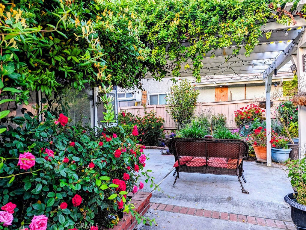 1738 Cambridge Circle Redlands, CA 92374 - Photo 7 of 59 a wooden bench sitting in front of a building