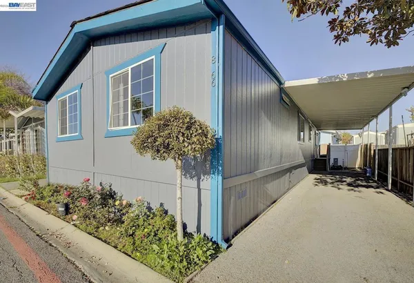a view of a house with a flower garden