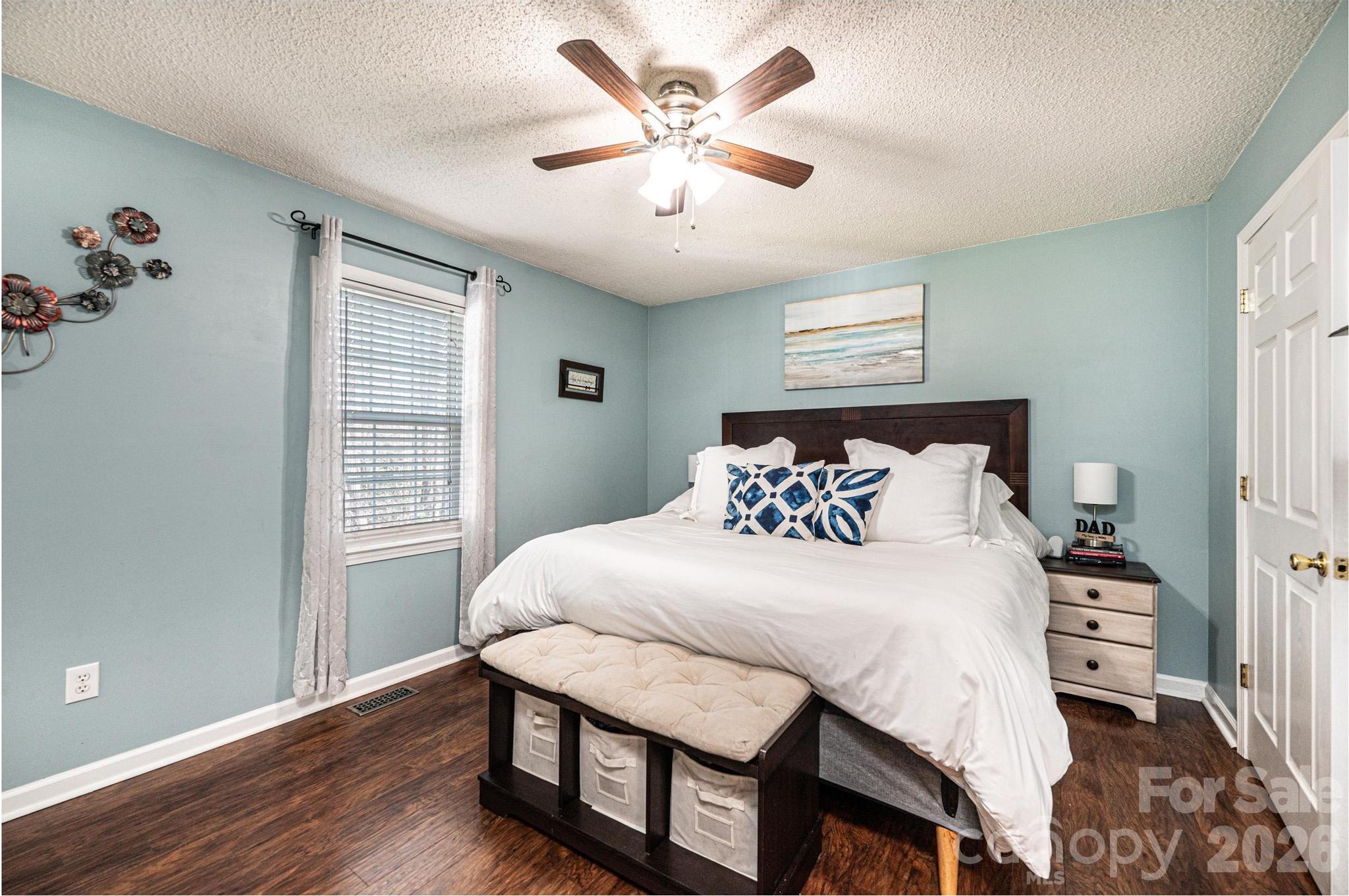 4984 Addison Lane Hickory, NC 28601 - Photo 14 of 32 a bedroom with a bed and a chandelier