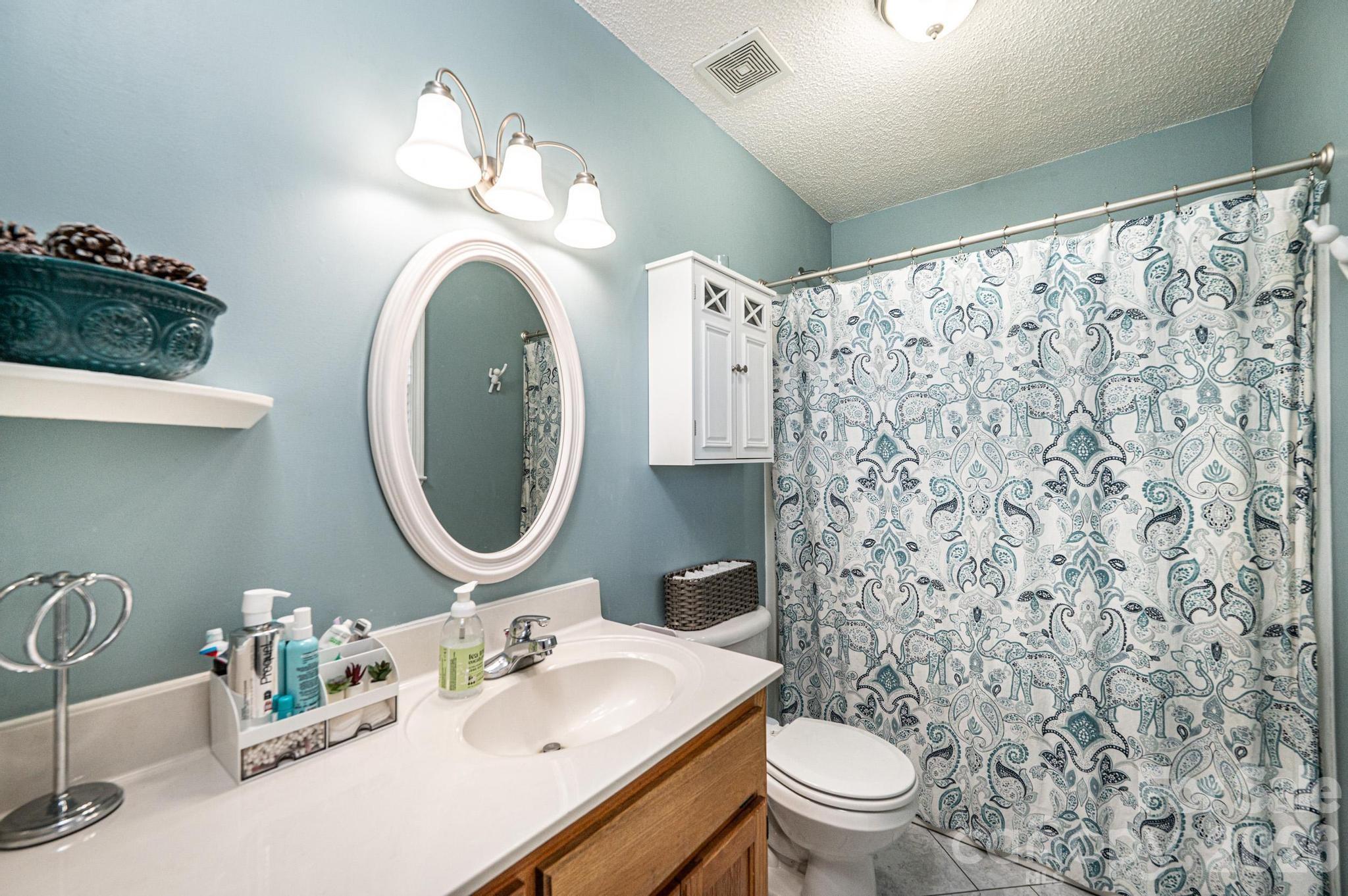 4984 Addison Lane Hickory, NC 28601 - Photo 16 of 32 a bathroom with a sink a toilet and a mirror