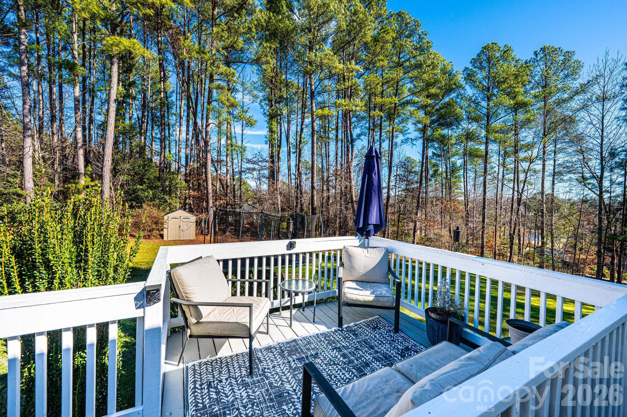 4984 Addison Lane Hickory, NC 28601 - Photo 29 of 32 a view of a wooden deck with a bench