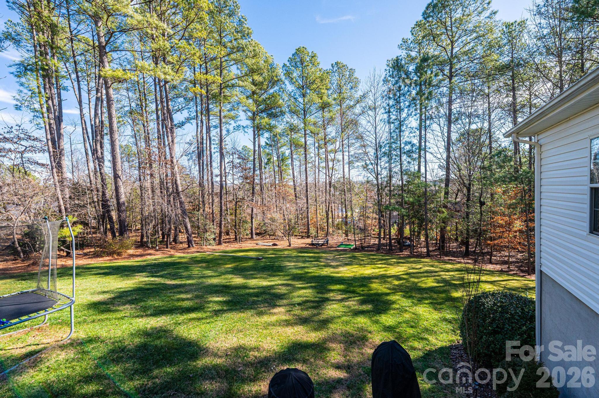 4984 Addison Lane Hickory, NC 28601 - Photo 30 of 32 a swimming pool with outdoor seating and yard