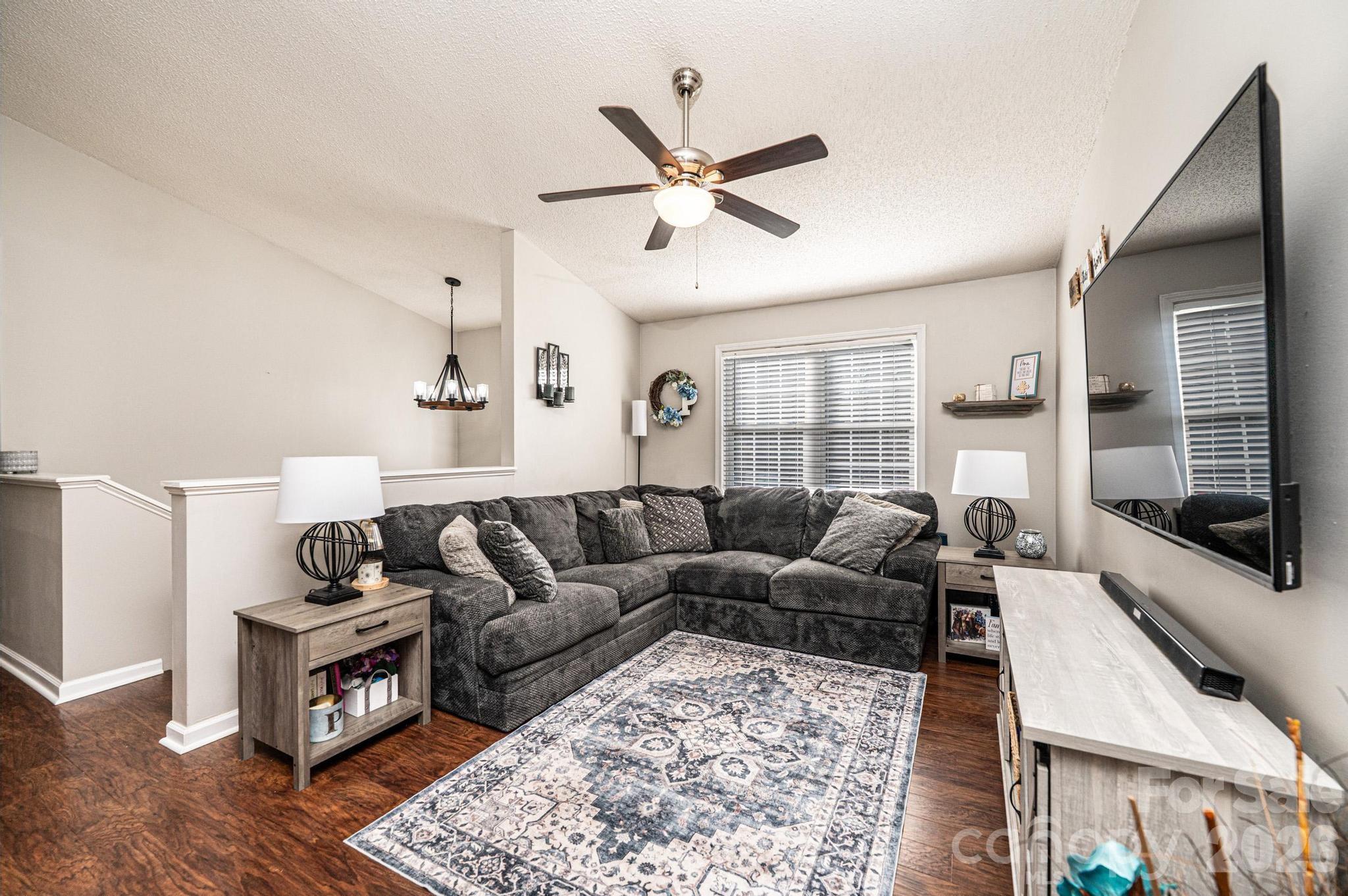 4984 Addison Lane Hickory, NC 28601 - Photo 4 of 32 a living room with furniture and a flat screen tv