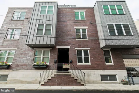 a front view of a building with glass windows