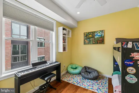 a room with furniture and musical instruments