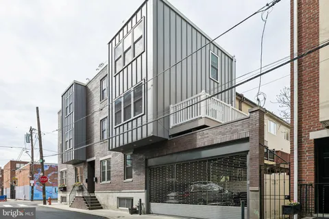 a view of a building with a street