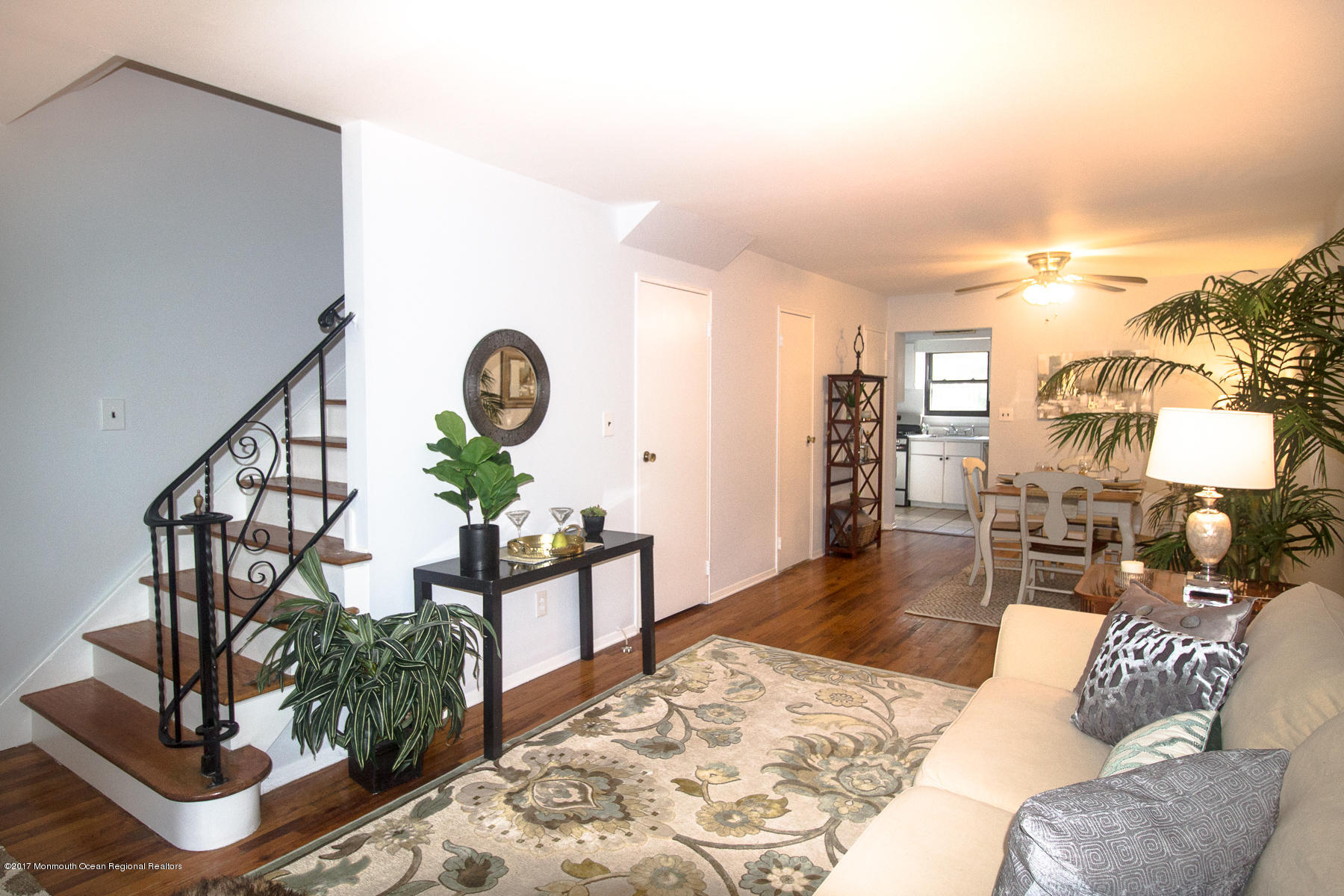 321 Spring Street, Unit 7 Red Bank, NJ 07701 - Photo 1 of 17 a living room with furniture a rug and a chandelier