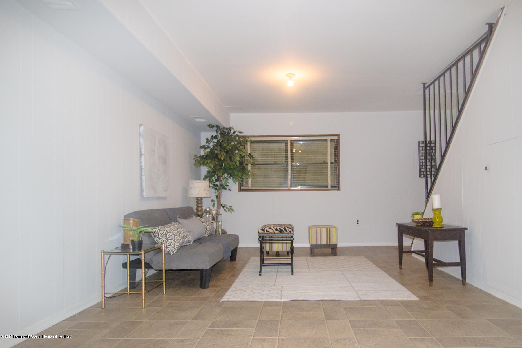 321 Spring Street, Unit 7 Red Bank, NJ 07701 - Photo 13 of 17 a living room with furniture and a potted plant