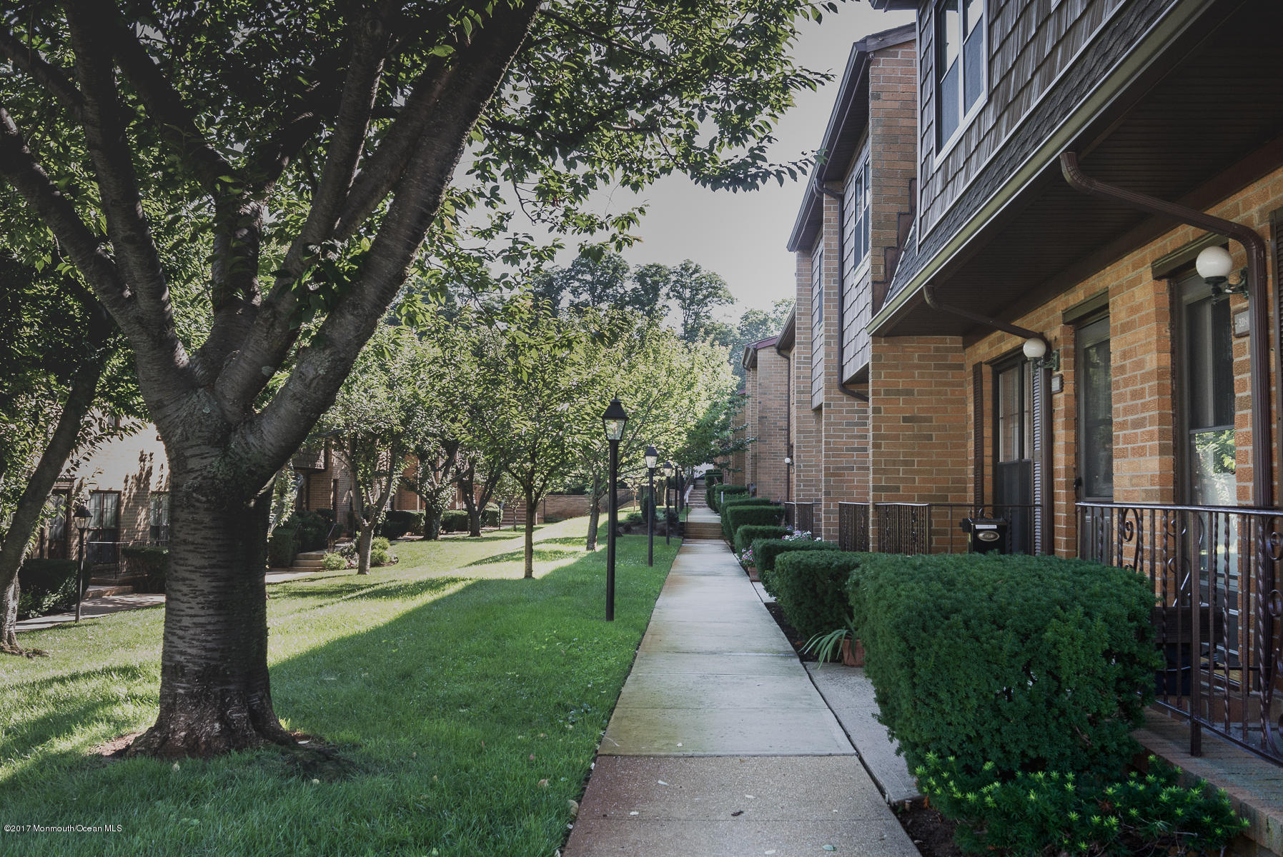 321 Spring Street, Unit 7 Red Bank, NJ 07701 - Photo 14 of 17 a walkway with trees on sides