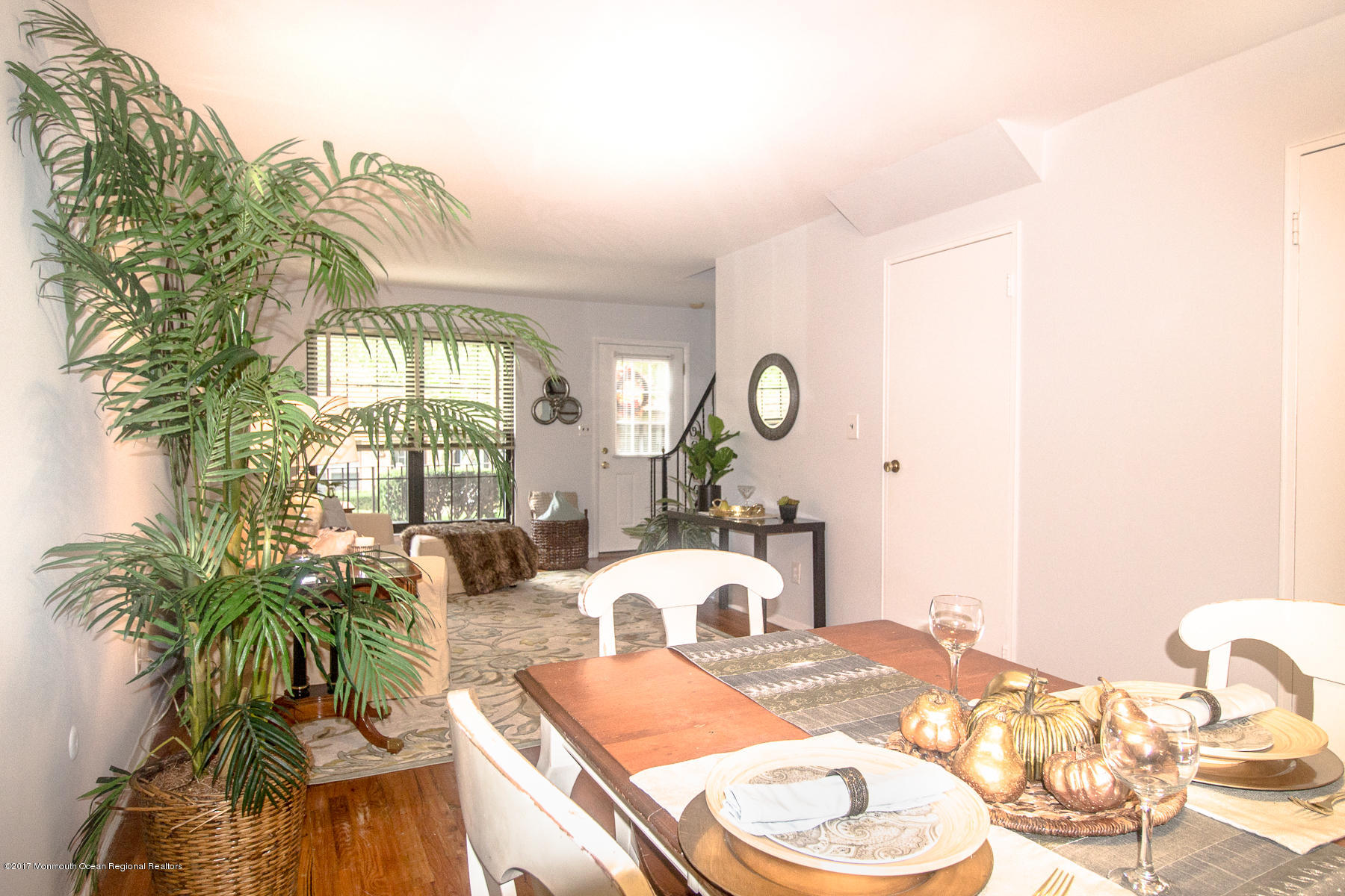 321 Spring Street, Unit 7 Red Bank, NJ 07701 - Photo 7 of 17 a living room with furniture and a mirror