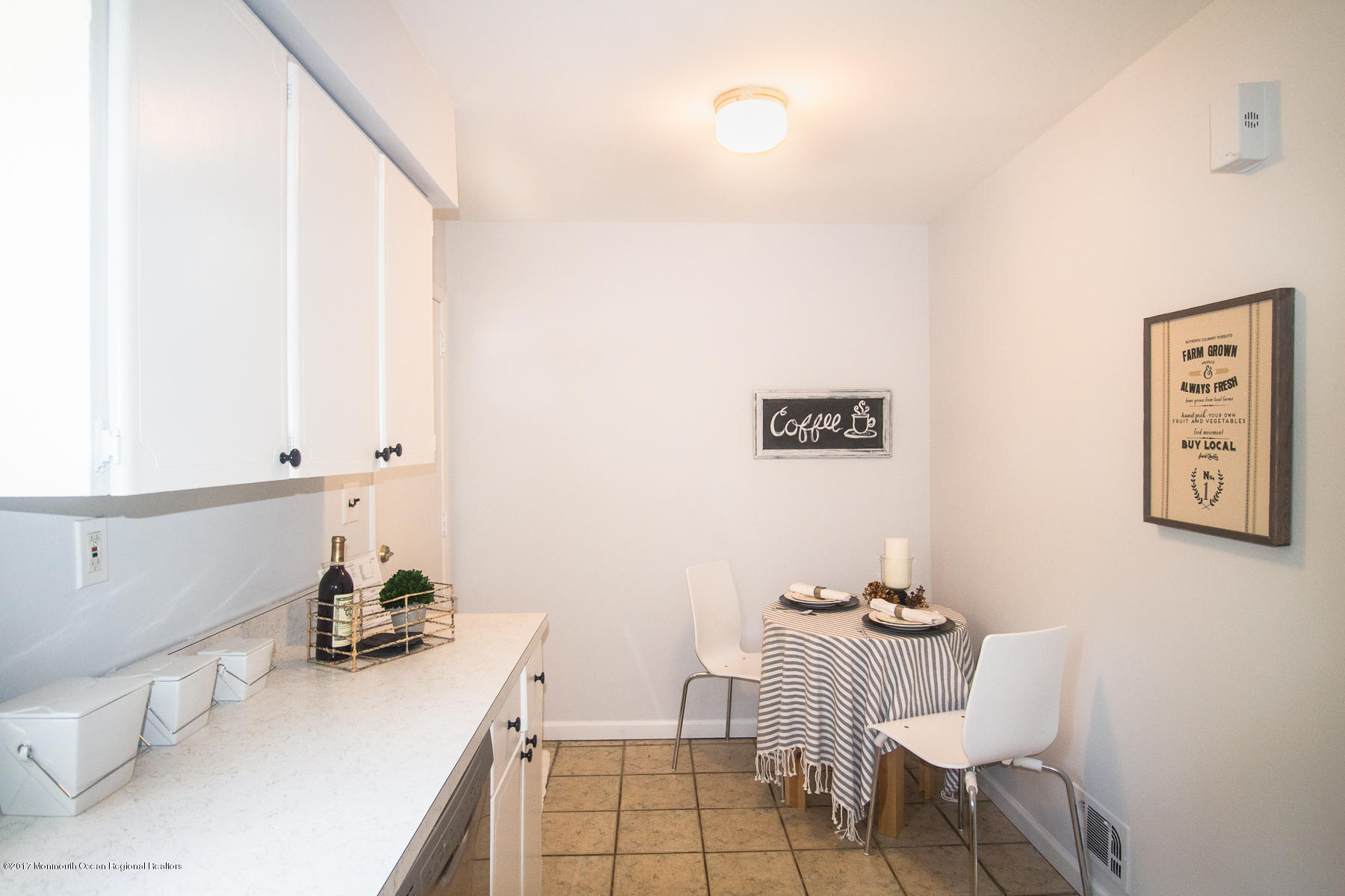 321 Spring Street, Unit 7 Red Bank, NJ 07701 - Photo 8 of 17 a room with a table and chairs