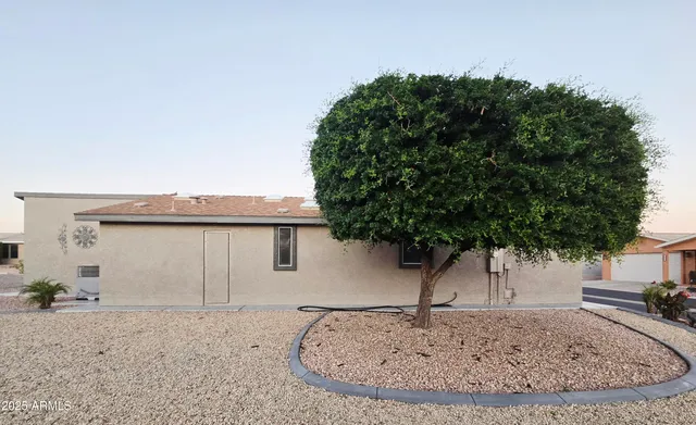 an empty room with closet and a flat screen tv