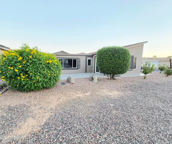 a kitchen with stainless steel appliances granite countertop a refrigerator a sink a stove a microwave and island