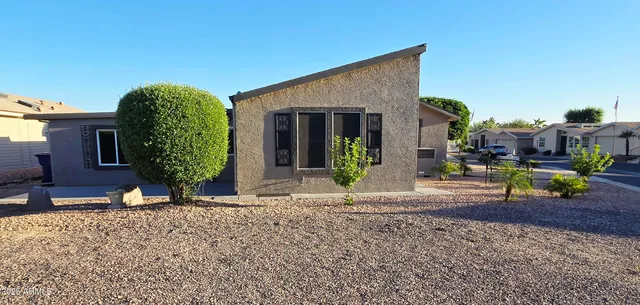 a kitchen with stainless steel appliances granite countertop a refrigerator a sink and a stove