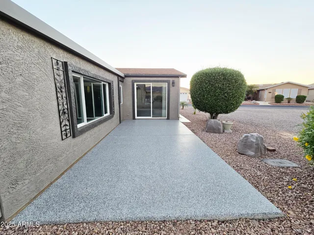 a kitchen with stainless steel appliances granite countertop a refrigerator a stove and a sink with cabinets