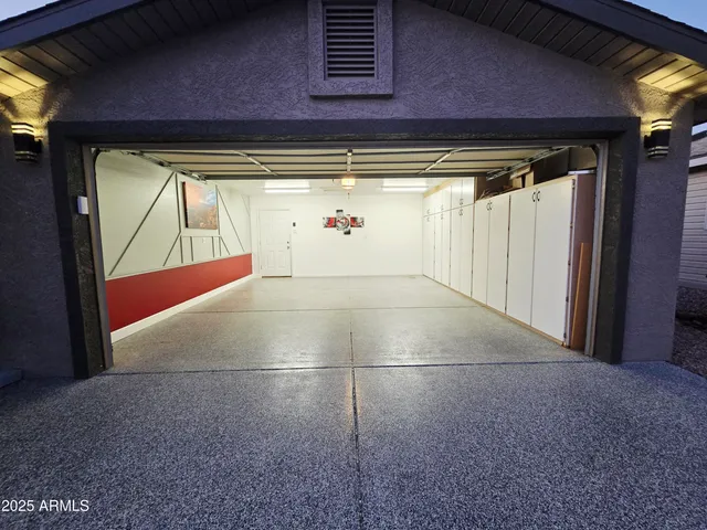a view of a bedroom with closet and ceiling fan
