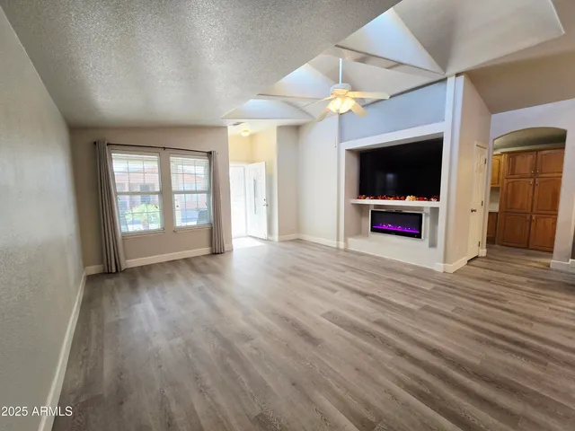 a view of an empty room with stairs